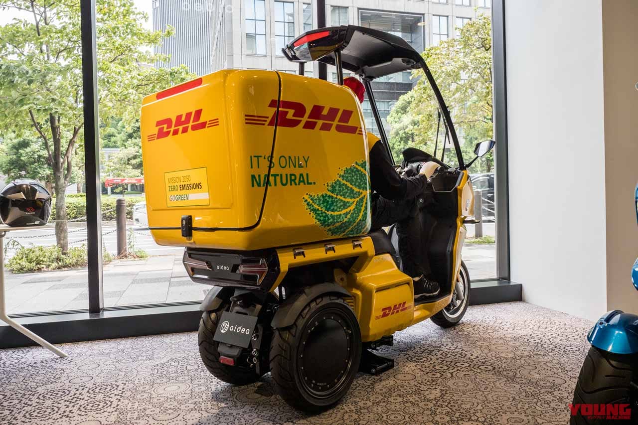 ドゲンジャーズの製作コンセプトはSDGSの一つ「人々に保険と福祉を」なんだとか(写真左)個人向けでコンパクトな荷物が増えていることから、効率化も期待され導入されているそう。(写真右)|マクドナルド、郵便局が配達に使う電動3輪スクーター aidea AA-Cargo β4試乗インプレッション